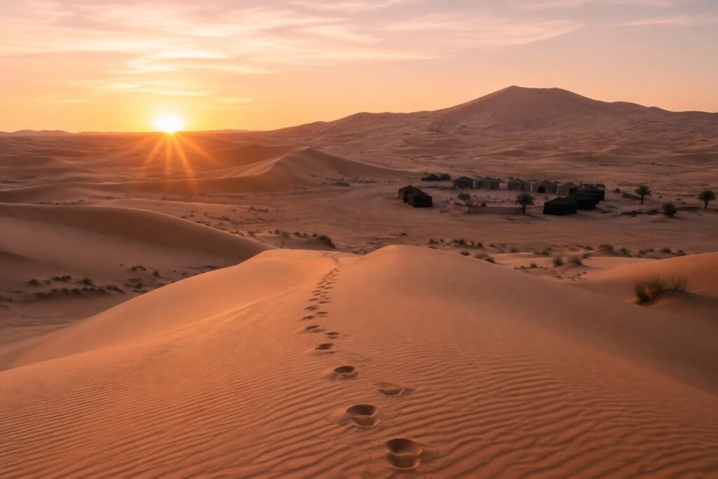 Sunrise over the Erg Chebbi dunes near a Sahara desert camp, Merzouga