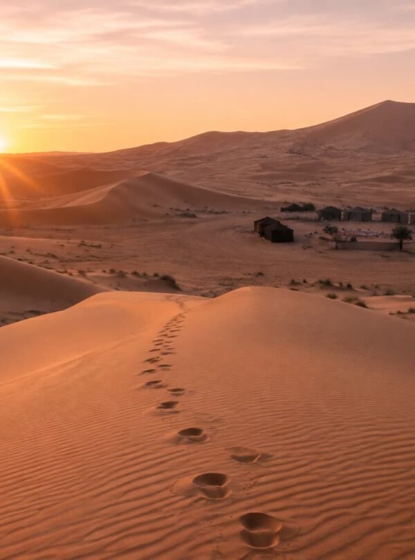 Sunrise over the Erg Chebbi dunes near a Sahara desert camp, Merzouga