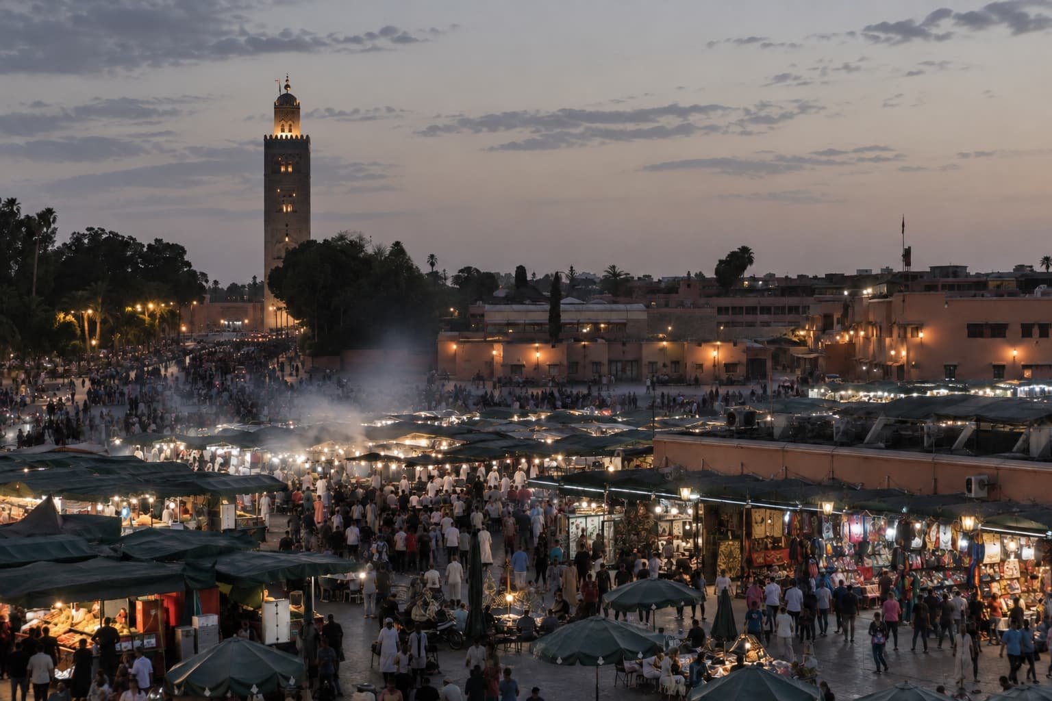 Jemaa el-Fna square at dusk, with the Koutoubia minaret in the background, Marrakech