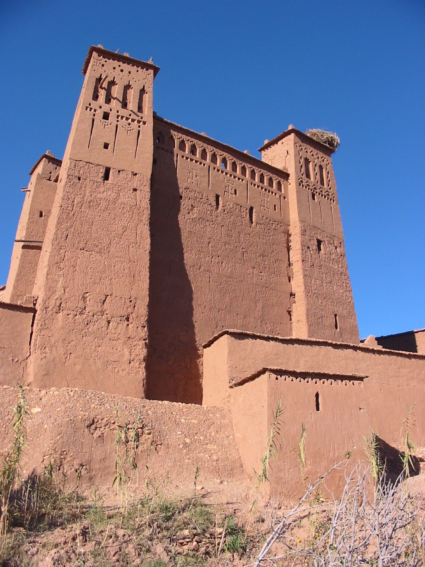 The earthen fortified kasbah of Ait Ben Haddou, a UNESCO World Heritage Site and the first major stop on the classic Morocco road trip route south from Marrakech
