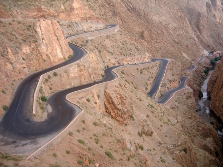 The winding switchback road climbing through Dades Gorge in the Anti-Atlas mountains of Morocco, one of the most photographed roads on the route to the Sahara