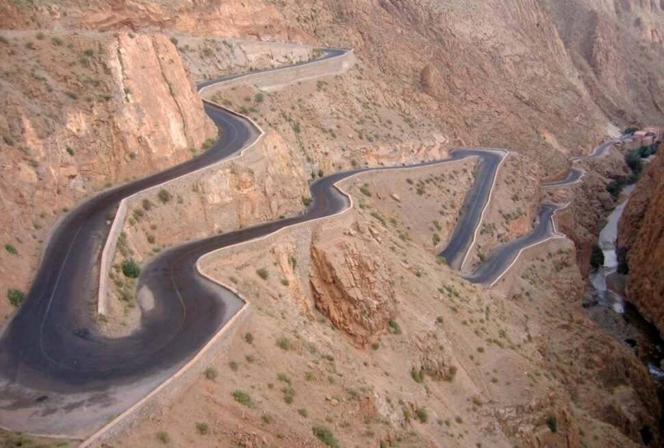 The winding switchback road climbing through Dades Gorge in the Anti-Atlas mountains of Morocco, one of the most photographed roads on the route to the Sahara