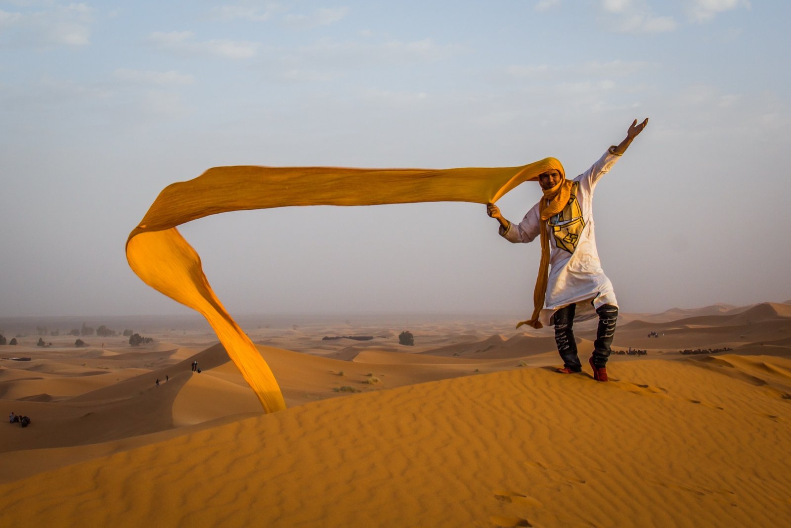 A traditional Berber shesh turban worn in the Sahara Desert near Merzouga, used to protect the face and head from sun, wind, and blowing sand