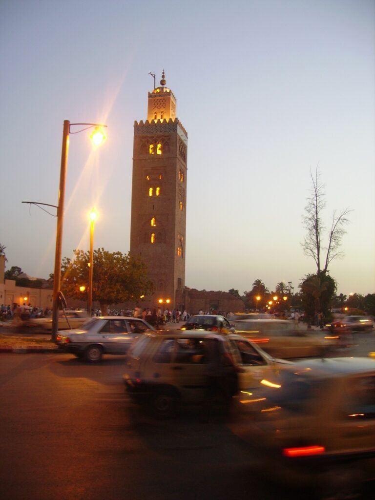 The illuminated Koutoubia Mosque minaret in Marrakech at night, the city's landmark during Ramadan evenings when the surrounding square comes alive after iftar