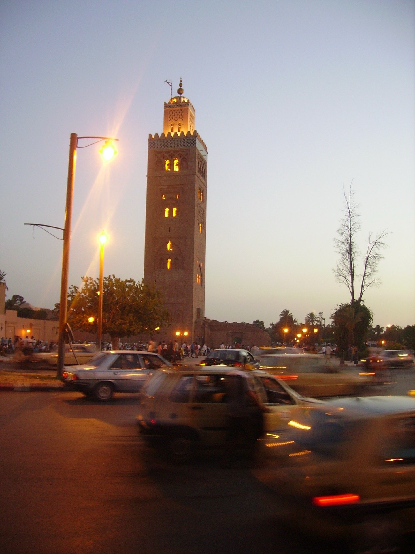 The illuminated Koutoubia Mosque minaret in Marrakech, the 12th-century Almohad-era landmark that became the template for Moroccan minaret architecture